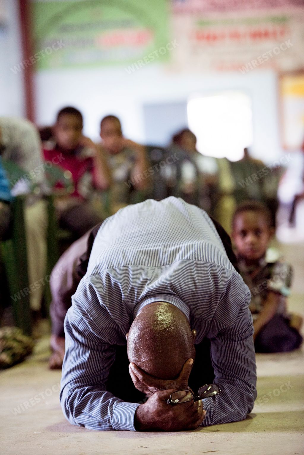 A man praying in a temple in Papua, New Guinea