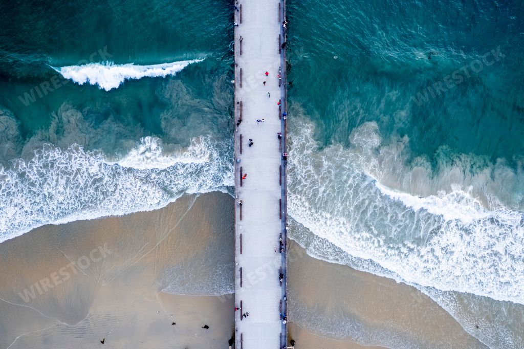 An aerial view of a long bridge in Newport Beach, California