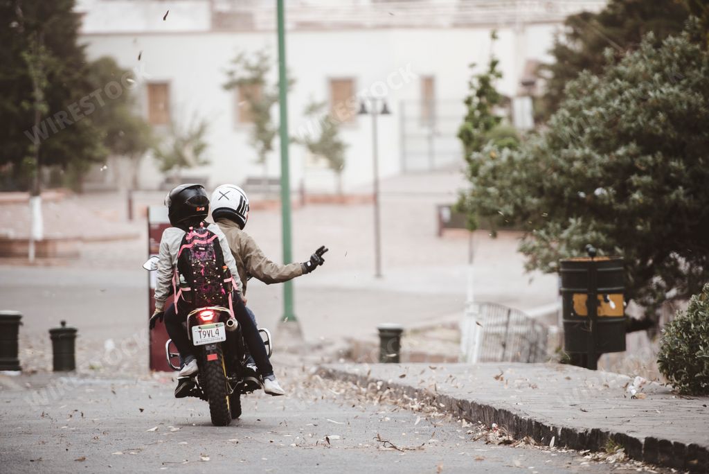 Some locals riding a motorcycle through the streets of Zacatecas, Mexico