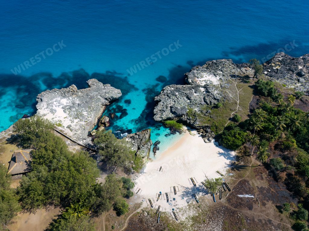 An aerial view of Pantai Mandorak with turquoise waters and cliffs. Sumba Island, Indonesia
