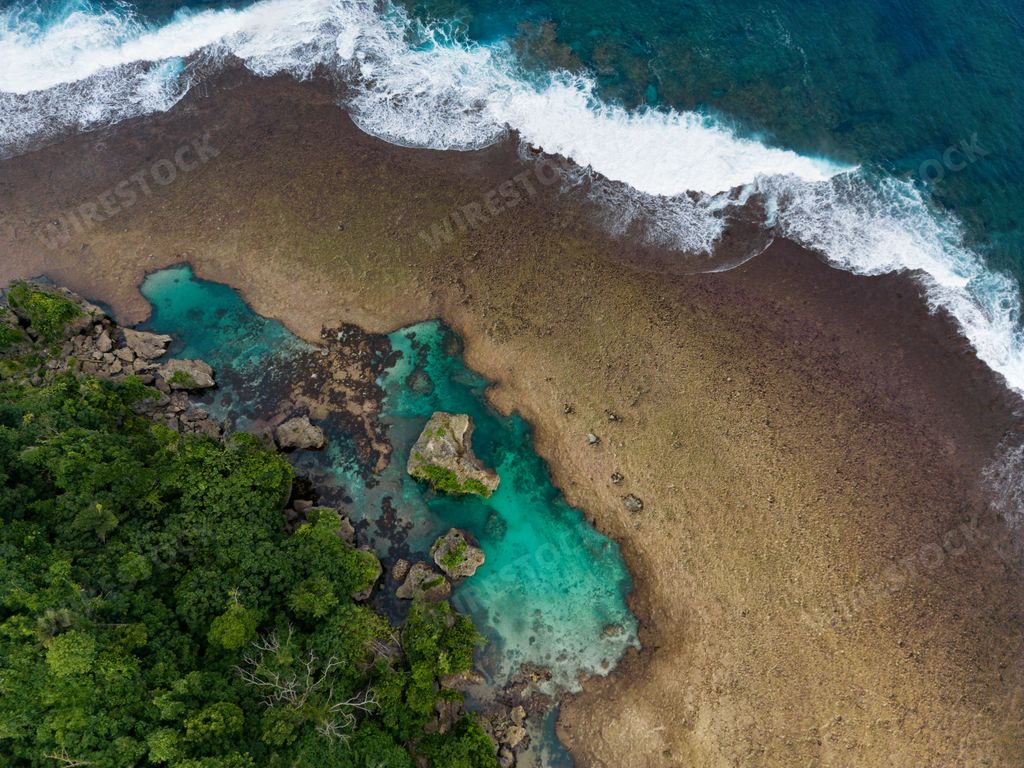 A scenic aerial view of Magpupungko Tidal Pool, Siargao, Philippines