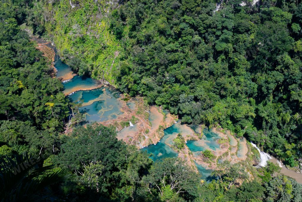 A large river and Semuc Champey natural monument in Guatemala, aerial, vertical