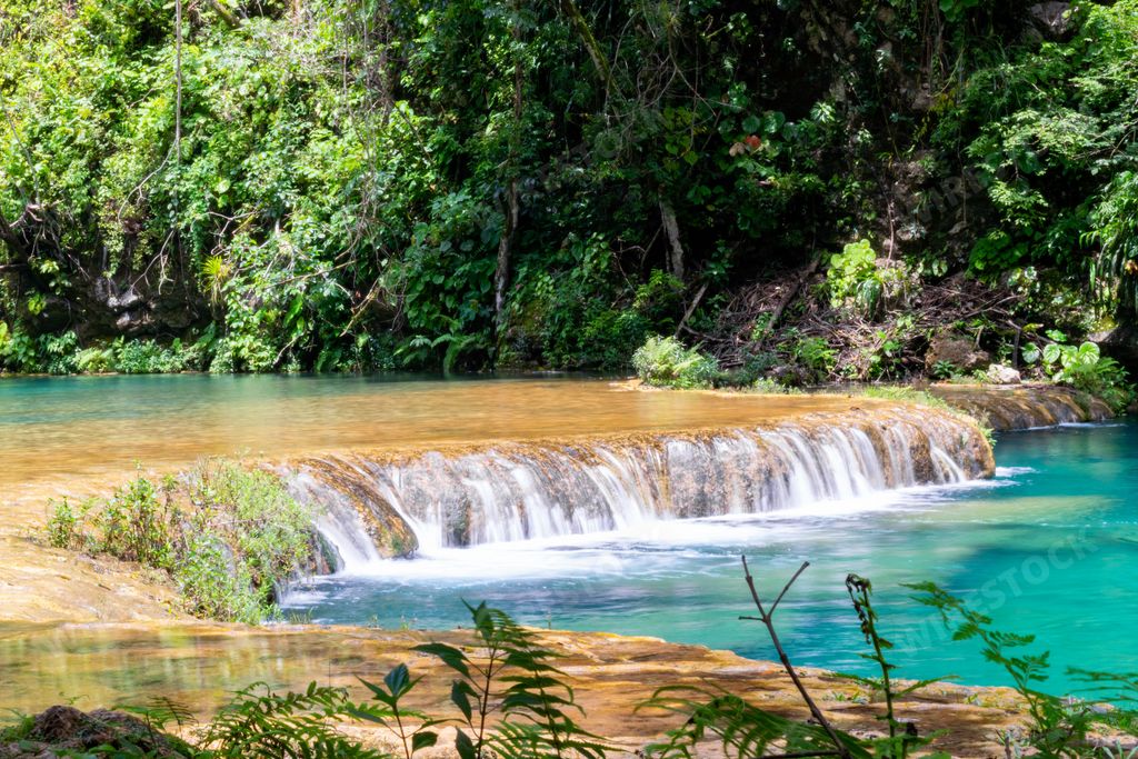 A large river and Semuc Champey natural monument in Guatemala, vertical