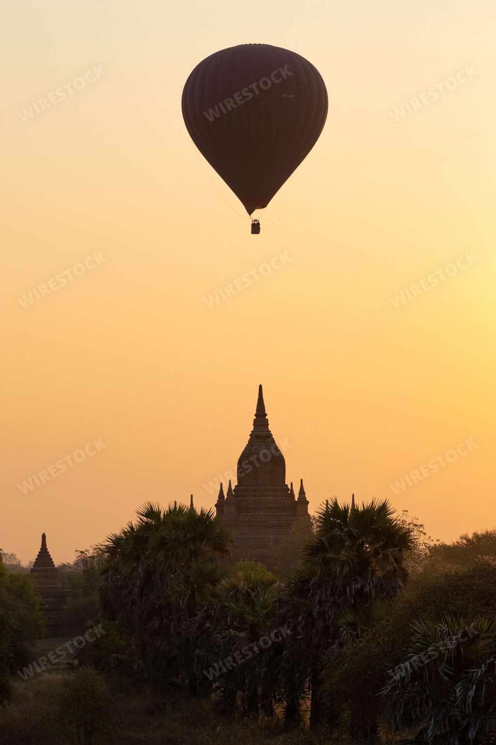 A scenic sunrise with a hot air balloon in Old Bagan, Myanmar (Burma)