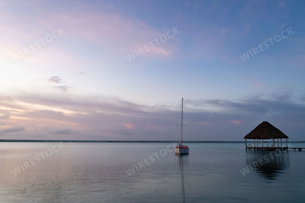 A beautiful sunrise over the Bacalar Lagoon, Mexico.
