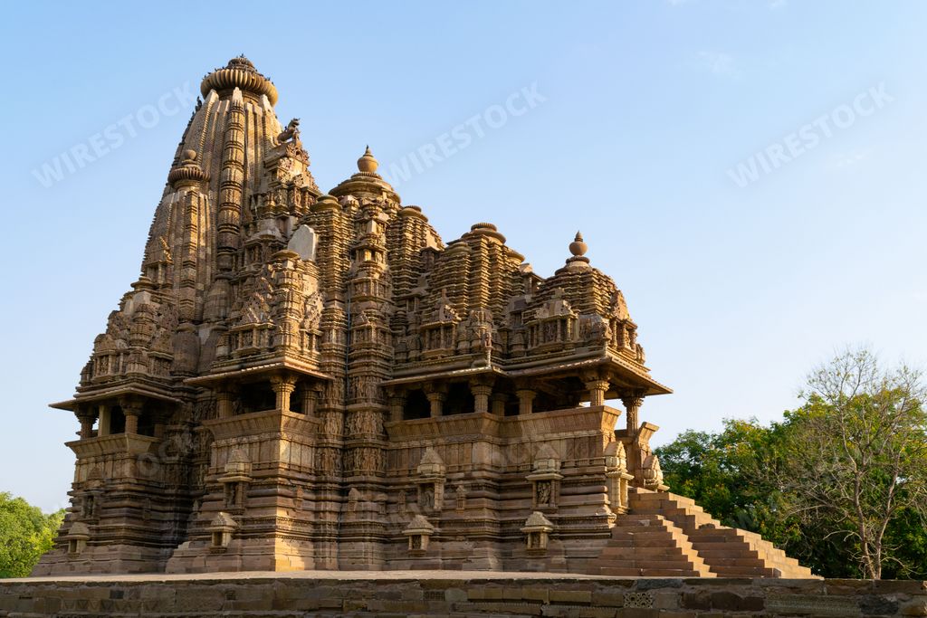 The Kandariya Mahadev Temple against blue sky background in India