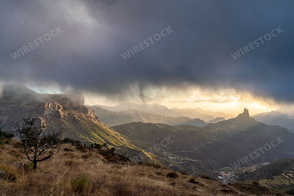 A landscape view of Roque Bentayga under dark clouds at sunset Gran Canaria, Canary islands