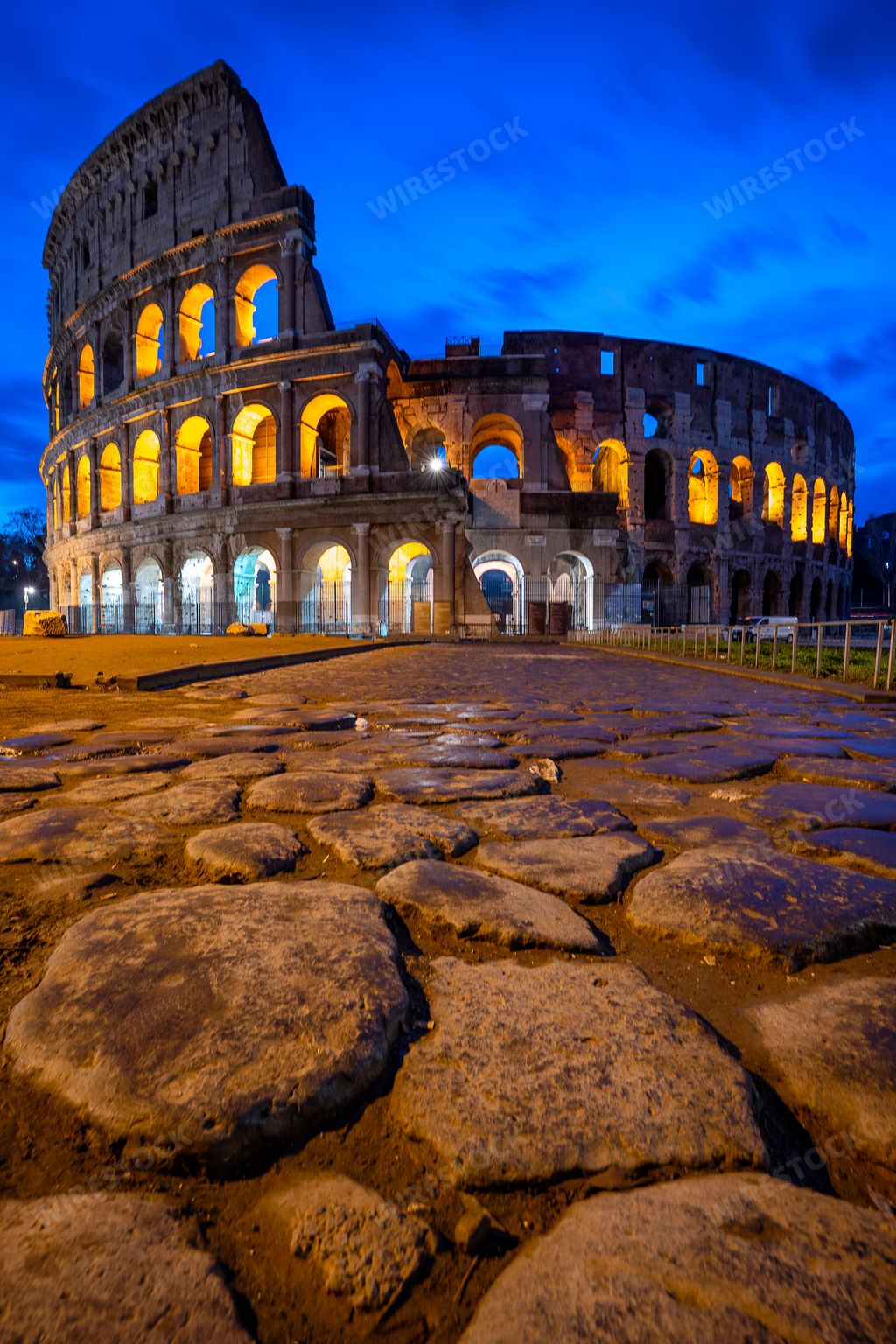 A mesmerizing view of the Colosseum in Rome at dawn