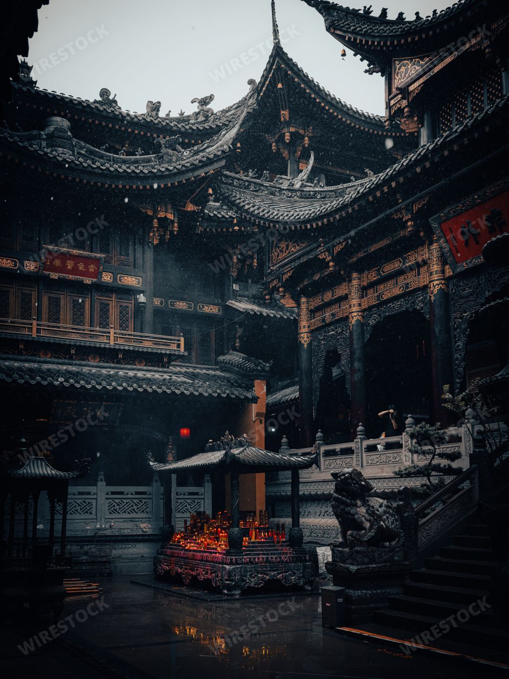 A vertical dramatic shot of an ancient traditional Chinese Buddhist Faxi Temple in Hangzhou