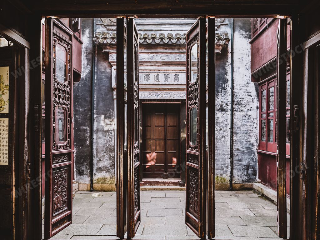 A part of a traditional Chinese house, open wooden doors leading to the courtyard
