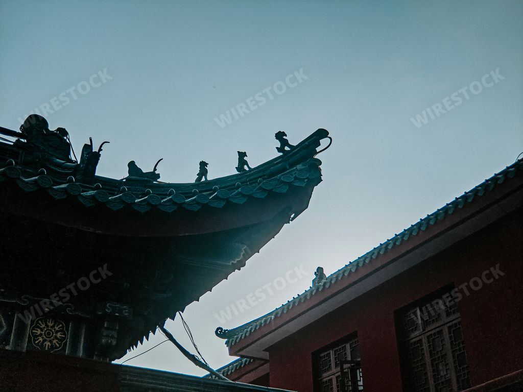 A low angle shot of a traditional Chinese temple roof