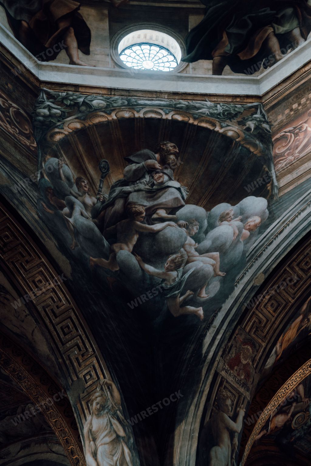 A vertical shot of a religious wall painting by Antonio Allegri da Correggio.  Parma Cathedral