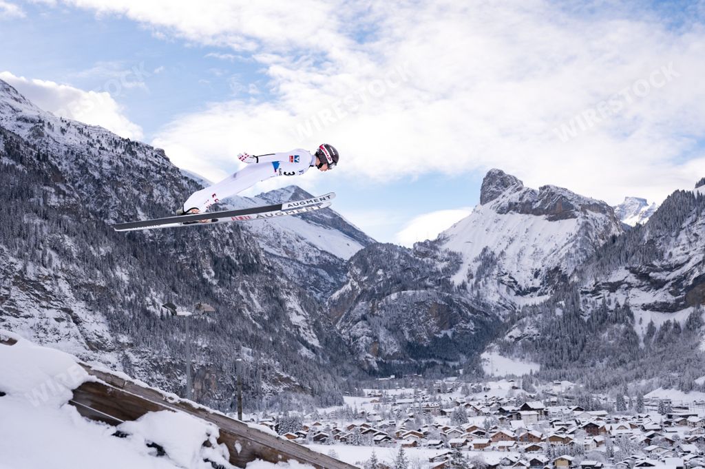 A beautiful shot of talented competitor during the Ski jumping Contest in Kandersteg at Nordic Arena during Wintertime, Switzerland