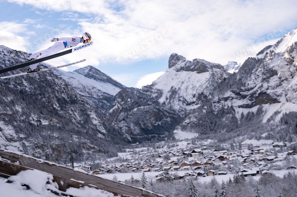 A beautiful shot of talented competitor during the Ski jumping Contest in Kandersteg at Nordic Arena during Wintertime, Switzerland
