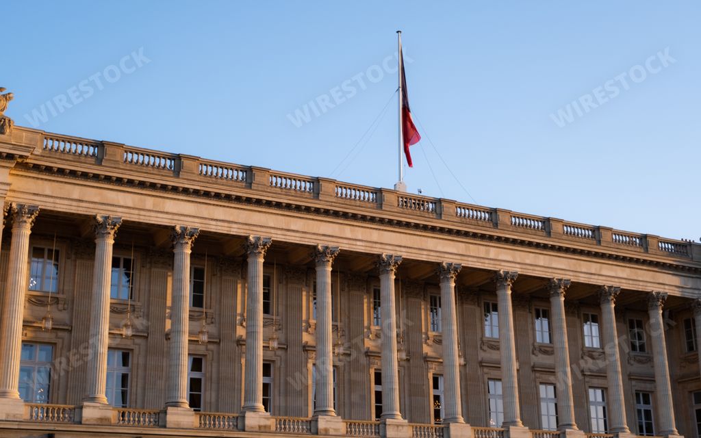The facade of Palais Brongniart adorned with ornate columns. Paris, France