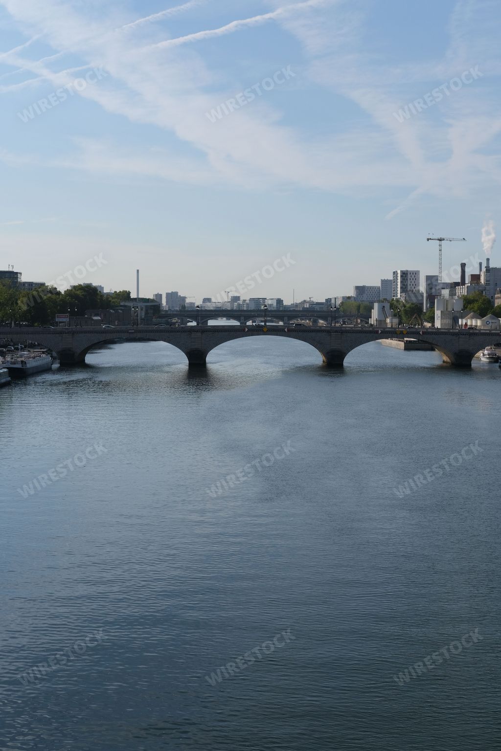 A scenic view of the Pont de Bercy Bridge and the Seine River in Paris, France