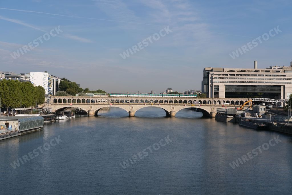 A scenic view of the Pont de Bercy Bridge and the Seine River in Paris, France