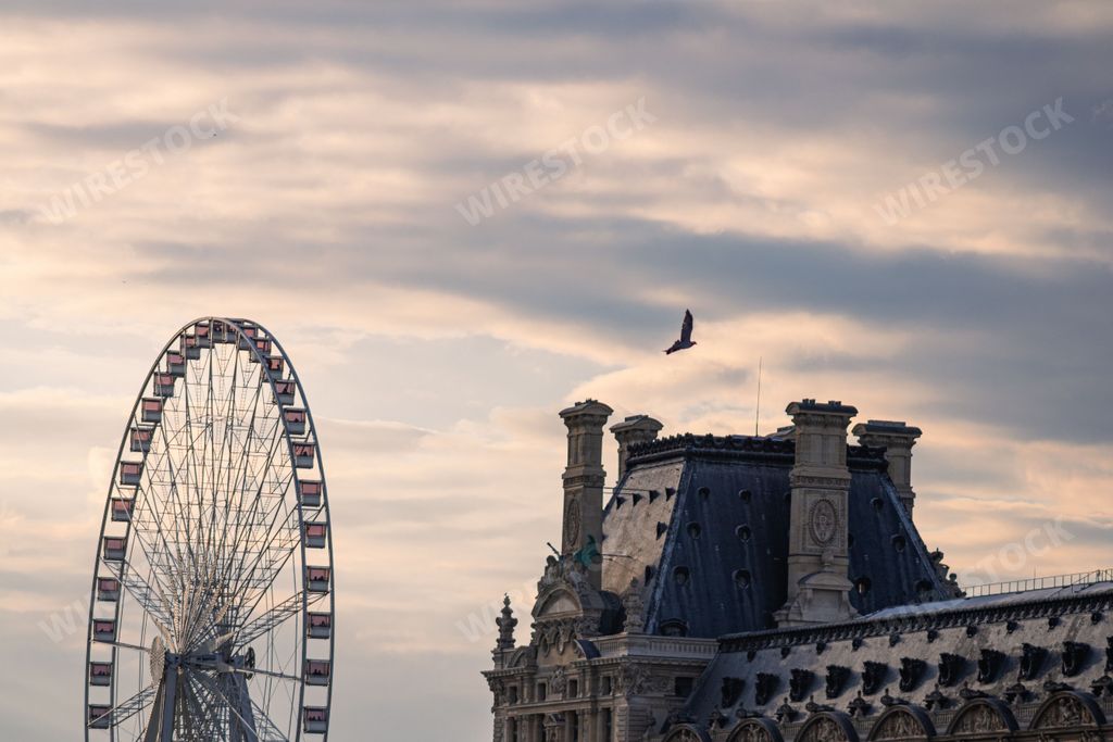 The large ferris wheel near the historic Louvre Museum in Paris, France
