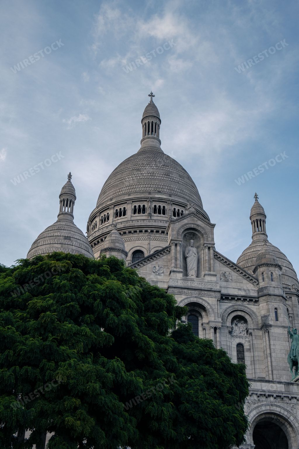 A vertical shot of The Basilica of Sacre Coeur de Montmartre at sunset in Paris, France