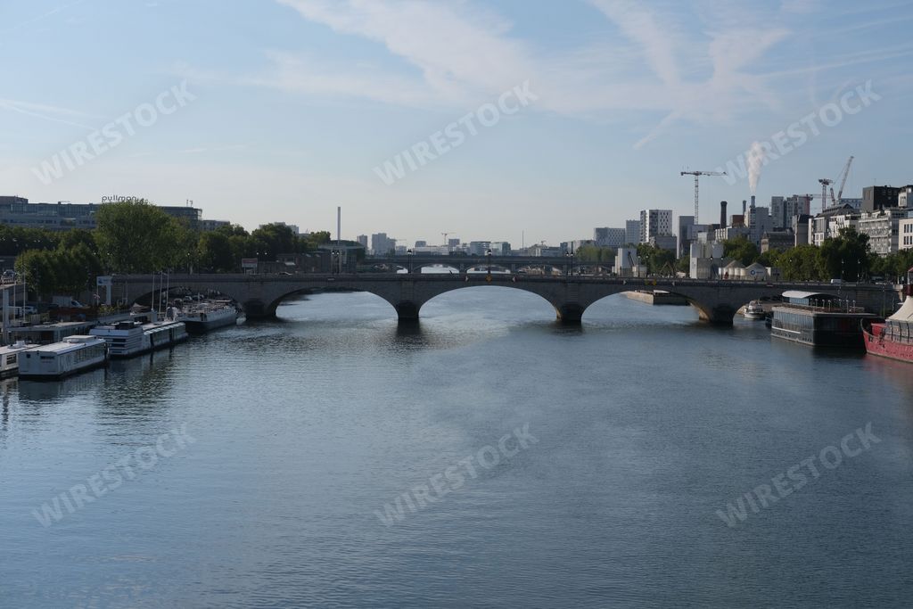 A scenic view of the Pont de Bercy Bridge and the Seine River in Paris, France