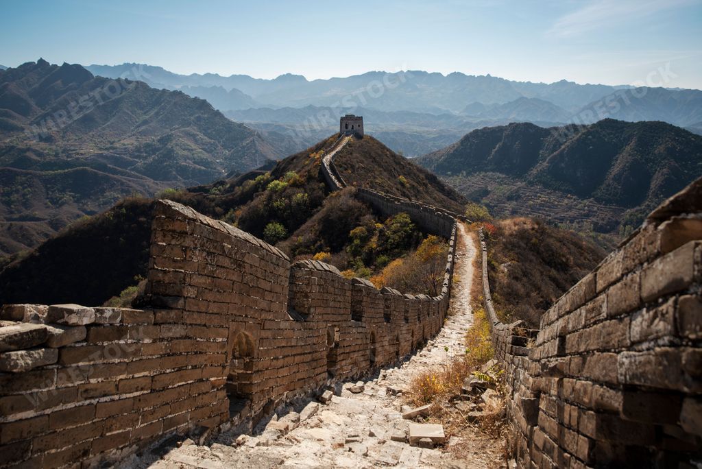 An aerial view of the Great Wall in a beautiful forest in China