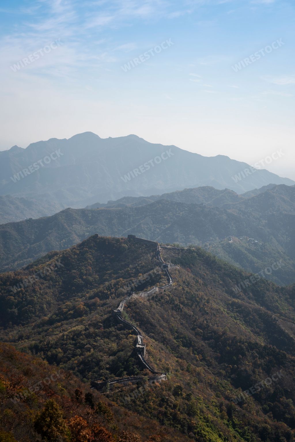 An aerial view of the Great Wall in a beautiful forest in China