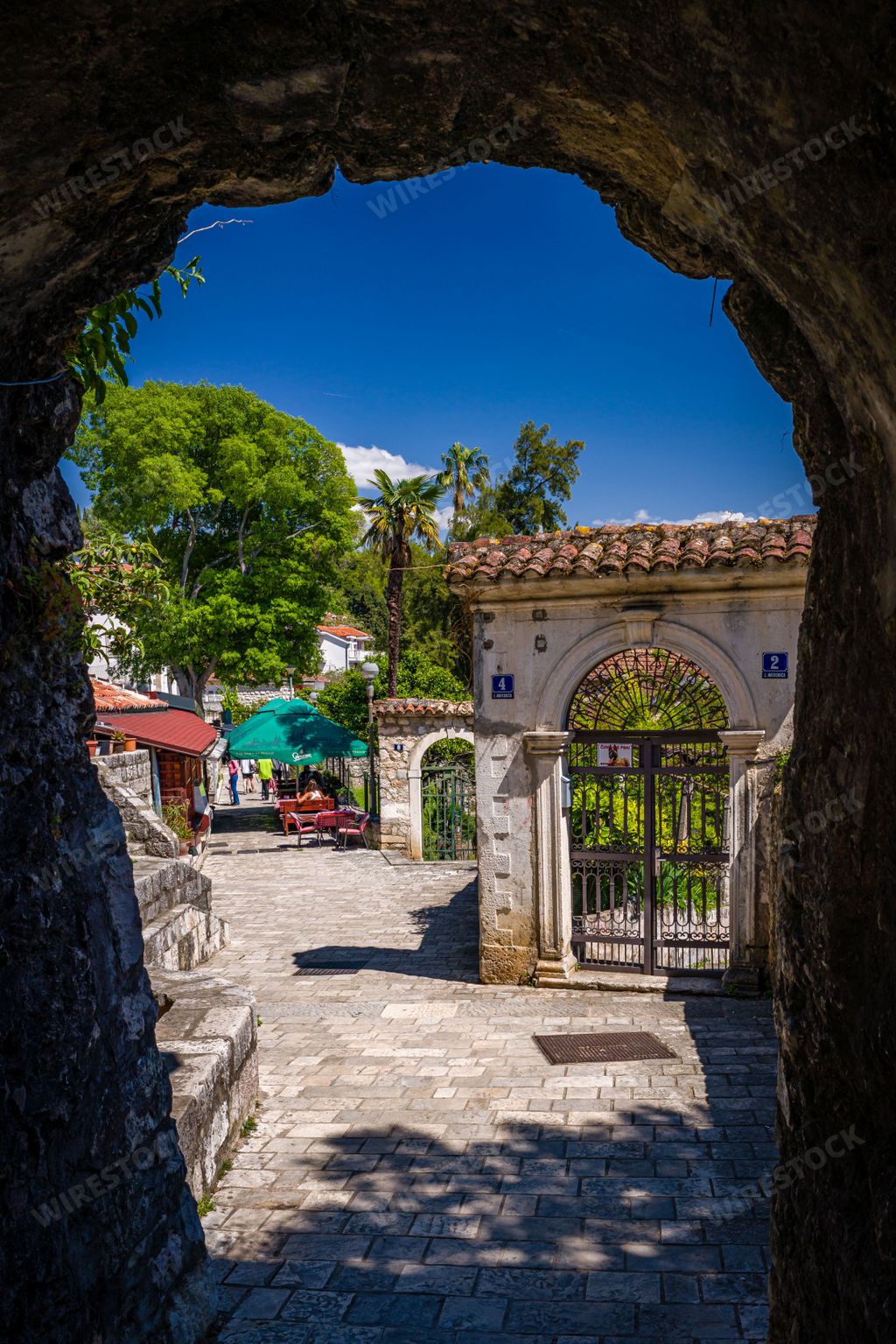 A vertical shot of a street in Bellavista square in the Herceg Novi old town in Montenegro.