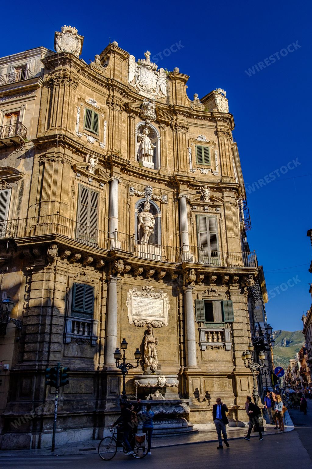 A vertical shot of the ancient monuments in Palermo, Sicily, Italy with tourists around
