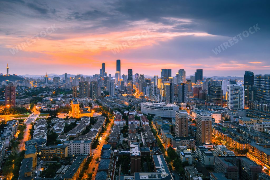 An aerial view of the stunning city skyline illuminated by the setting sun in Dalian, China