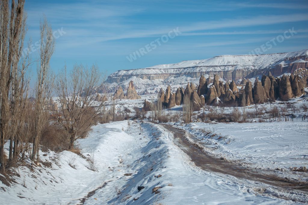 A beautiful shot of the fairy chimneys in Cappadocia on a snowy day