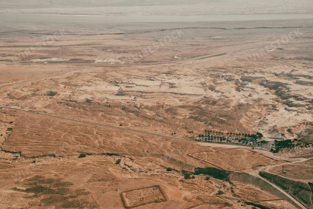 An aerial view of a desert landscape from Masada, the mountain top fortress in Israel
