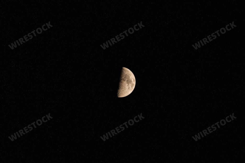 Clear view of quarter moon in a black night sky - half moon Stock photo ...