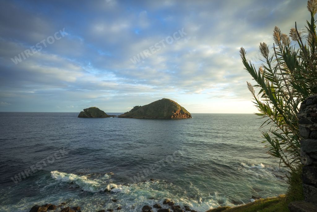 A picturesque seascape with two hills in the distance. Vila Franca do Campo, Sao Miguel, Azores