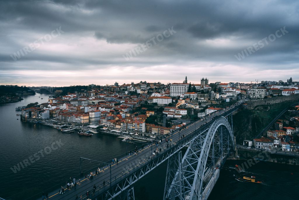 An aerial view of the Ponte Dom Luis bridge near the skyline of Porto, Portugal