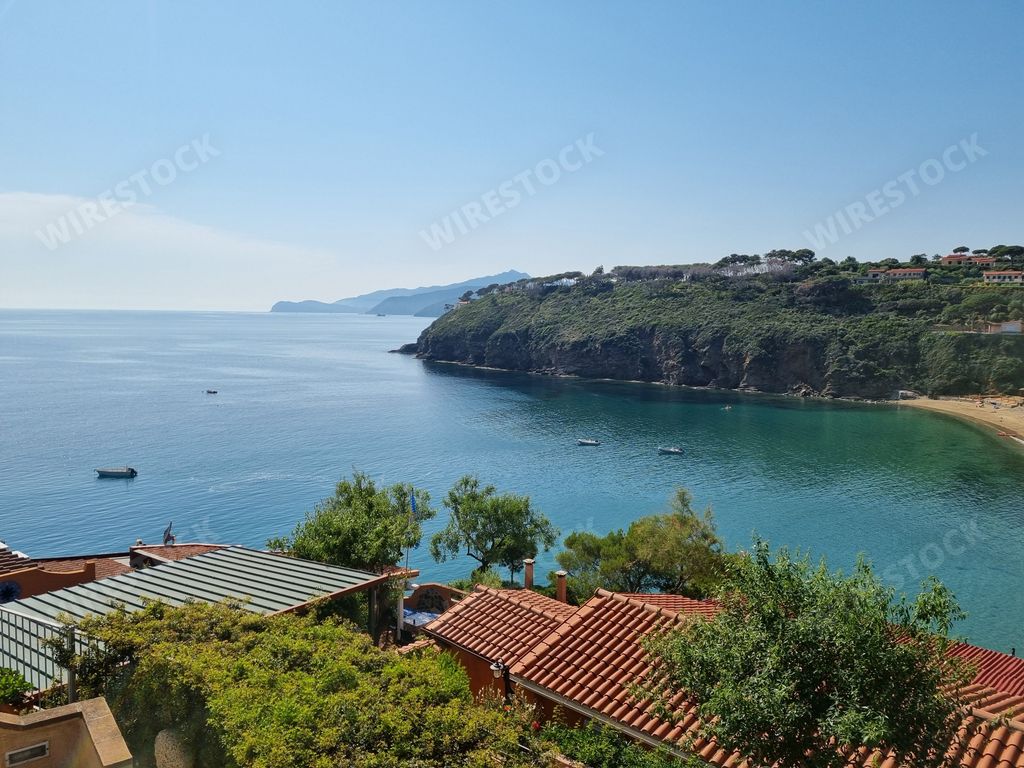 An aerial view of a picturesque Mediterranean coastal town in Elba, Italy