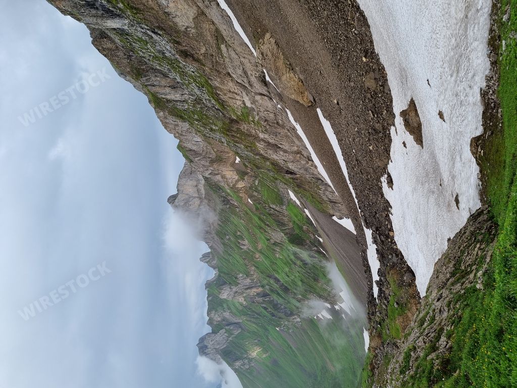 A closeup view of some of the parts of the mountain covered in snow on a gloomy day