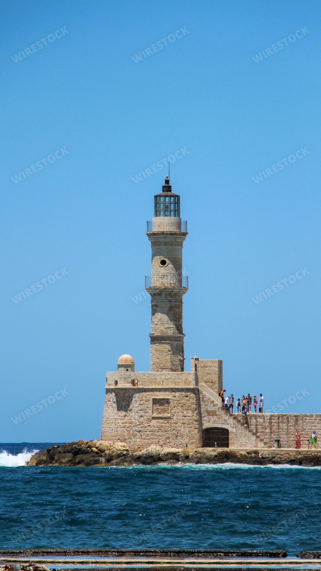 A vertical shot of a lighthouse on the coast of Heraklion, Crete, Greece