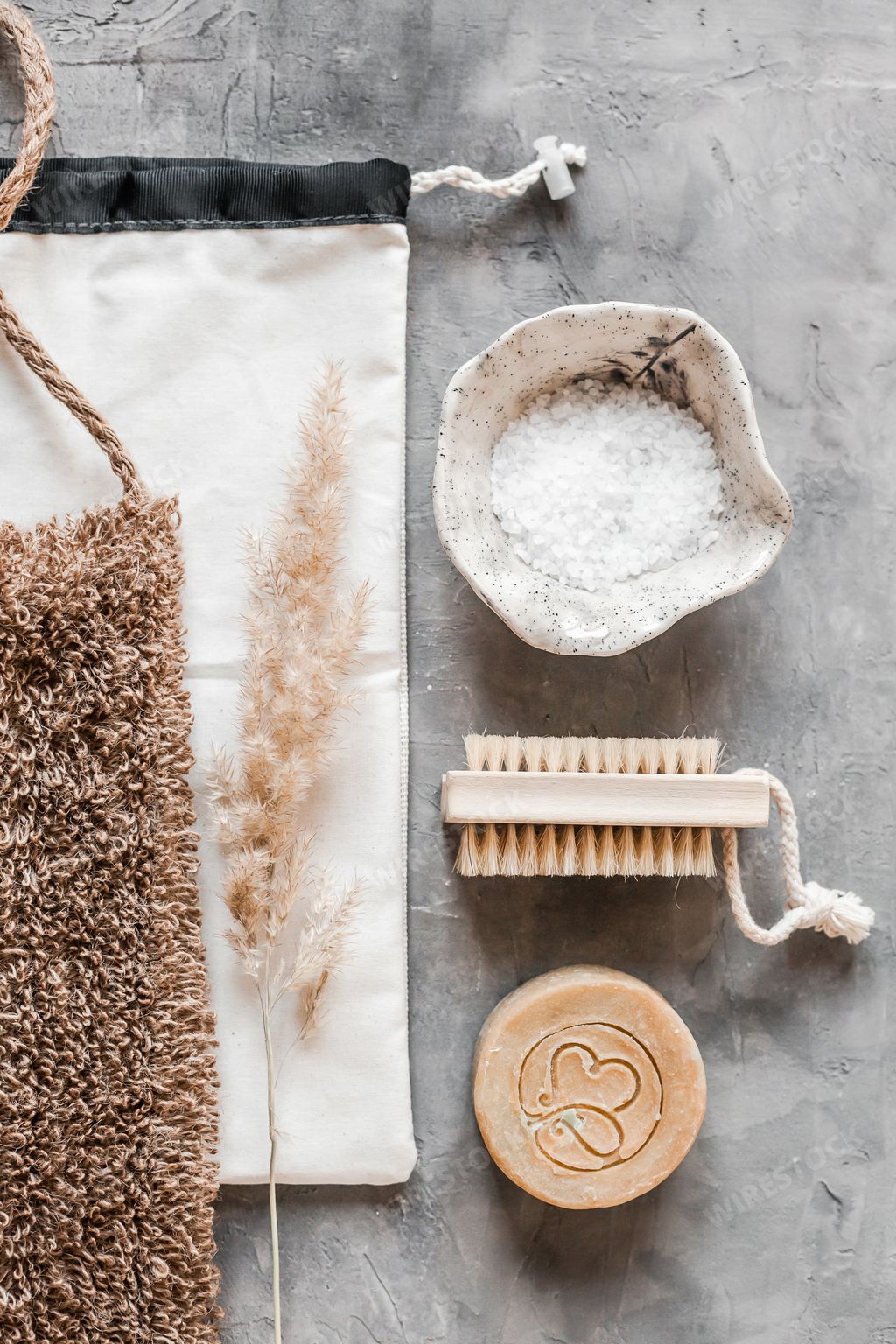 A vertical top view of plastic-free zero waste bathroom accessories or supplies for personal hygiene