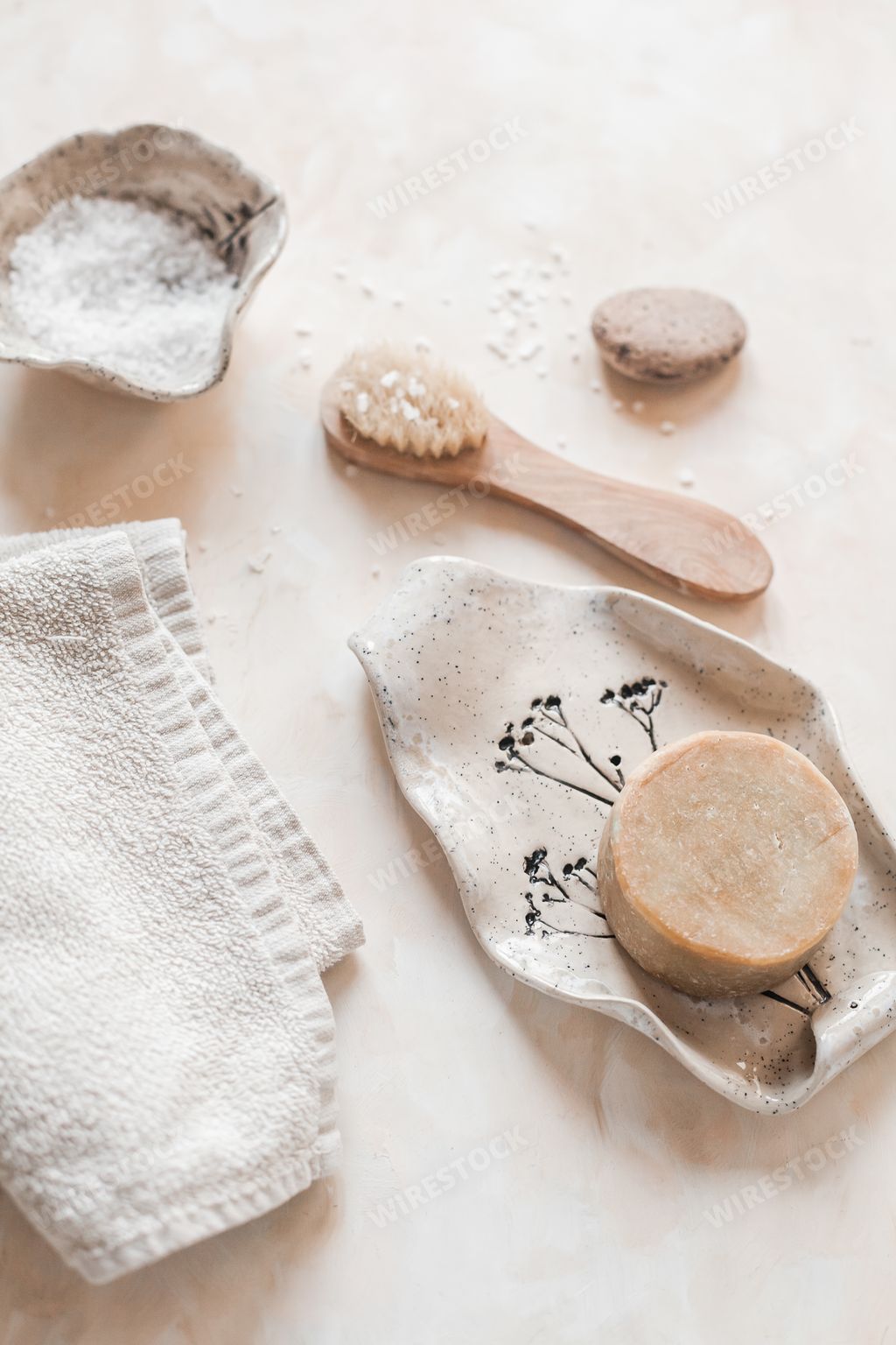 A vertical top view of plastic-free zero waste bathroom supplies for personal hygiene