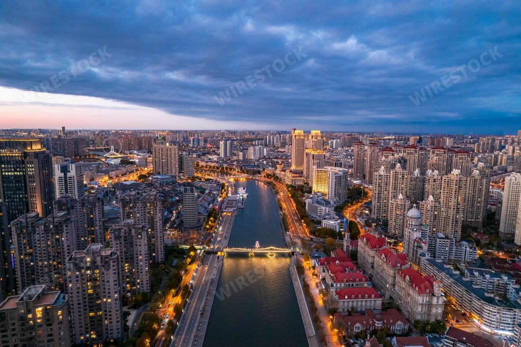 An aerial view of the Haihe River and the modern skyscrapers under the cloudy sky in Tianjin China