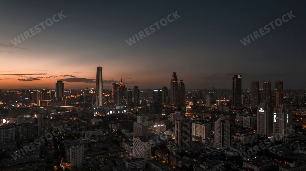 An aerial view of TianJin skyline on orange-blue sunset sky background in China