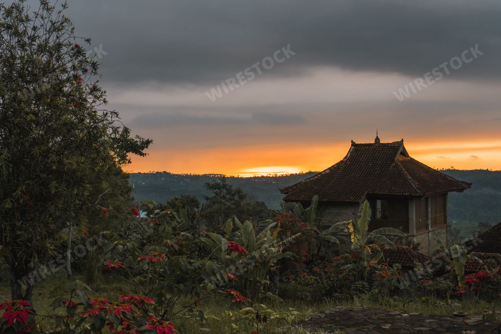 A bungalow in the Bali jungle during sunset photo, tropical landscape