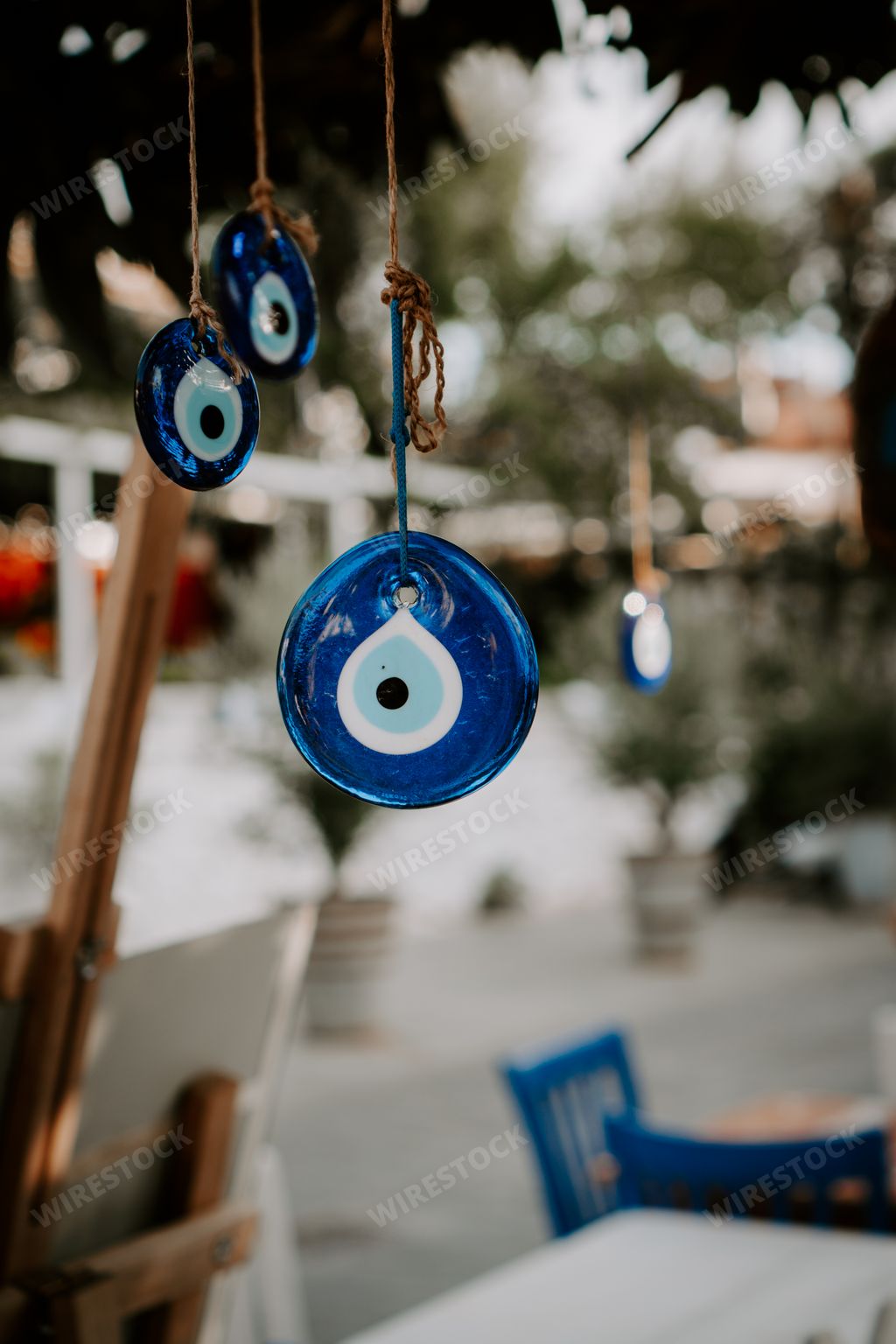 Traditional turkish amulet Nazar, Turkish Evil eye, Nazar boncugu.
Turkish eye-shaped amulet hanging on a tree. Turkey