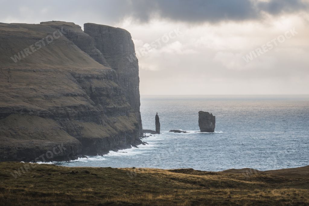 Steep cliffs of Faroe Islands. Vertical cliffs. Massive rocky cliffs ...