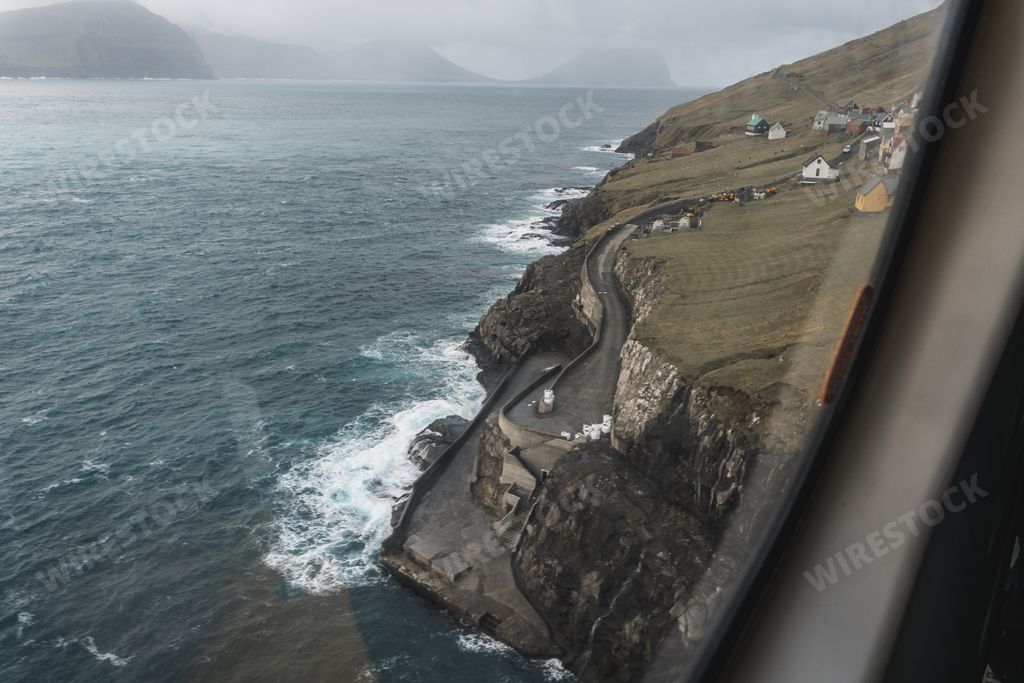 Cliffs and Atlantic ocean from above. Faroe islands view from helicopter