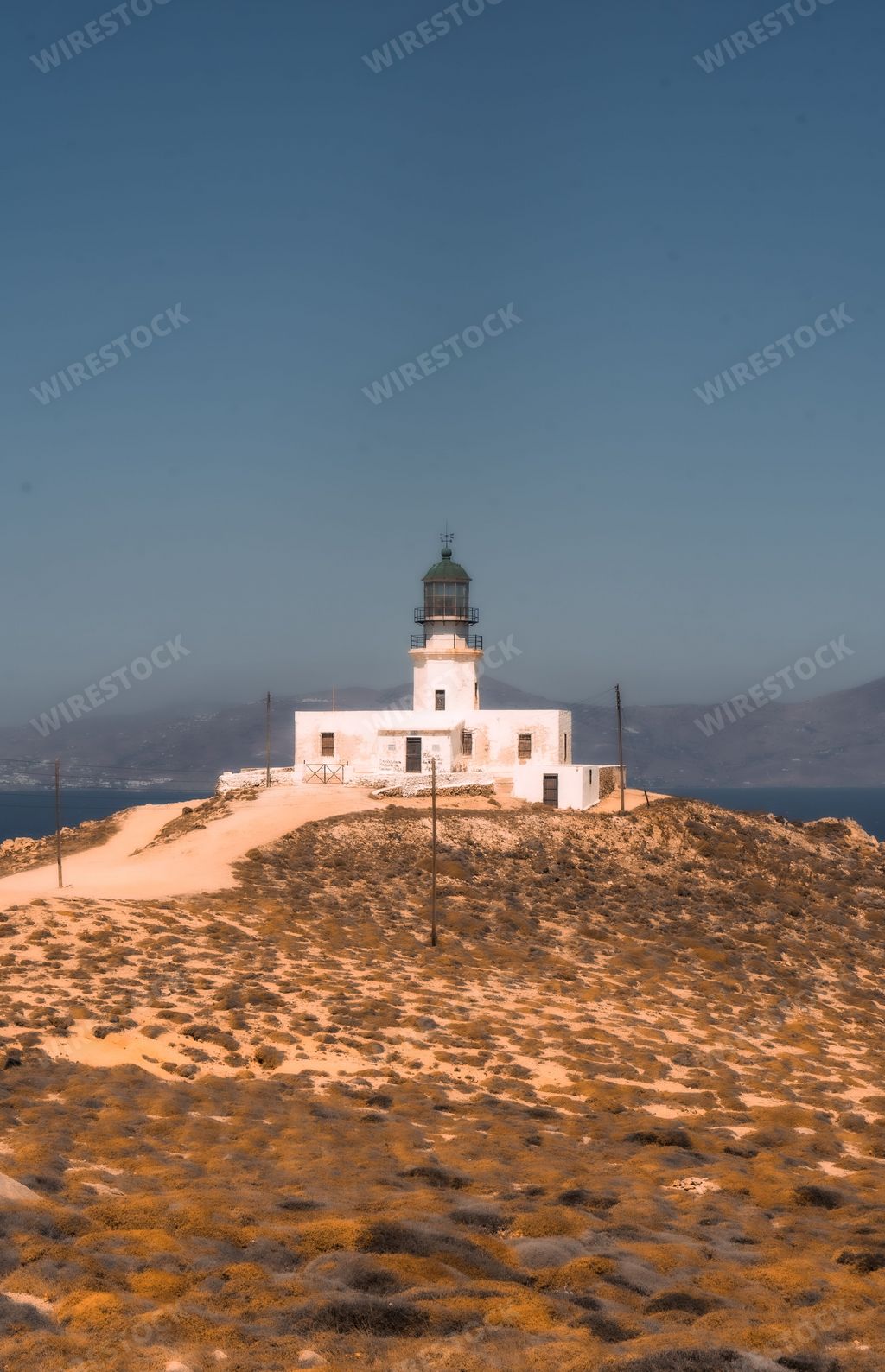 A breathtaking view of Armenistis lighthouse located on the picturesque Mykonos island in Greece