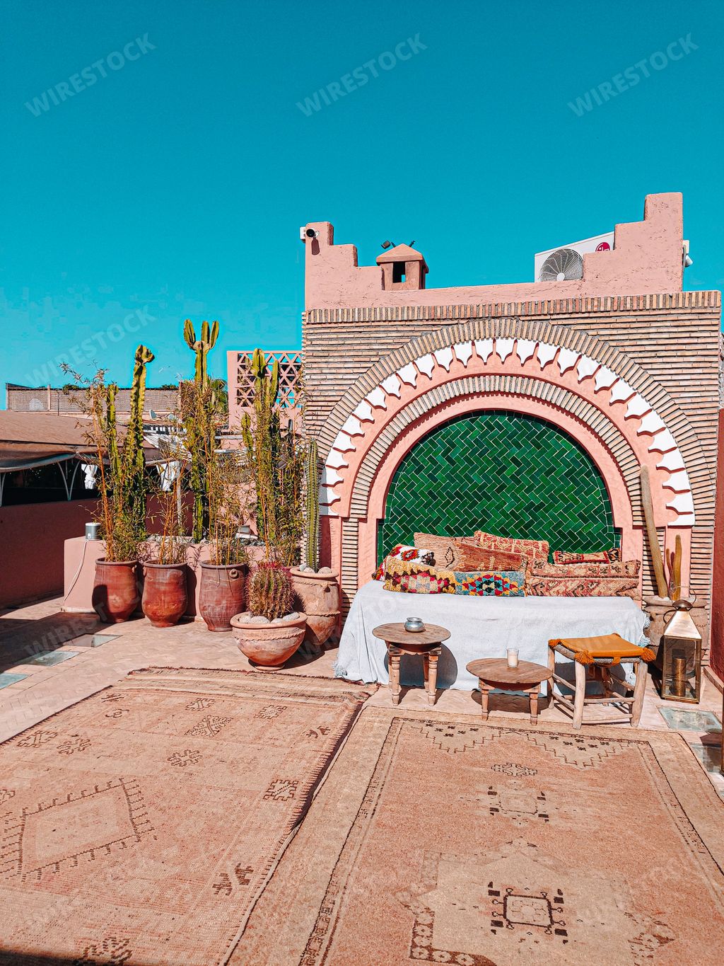 A traditional Moroccan rooftop riad under the clear blue sky