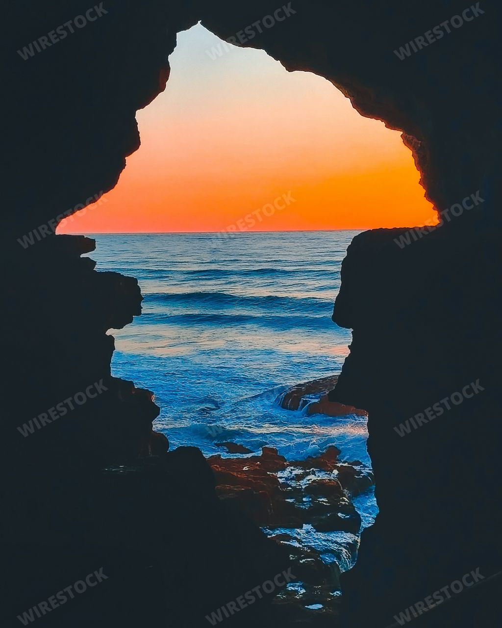 A beautiful shot of Hercules Cave's silhouette in Cape Spartel, Morocco on background of sunset