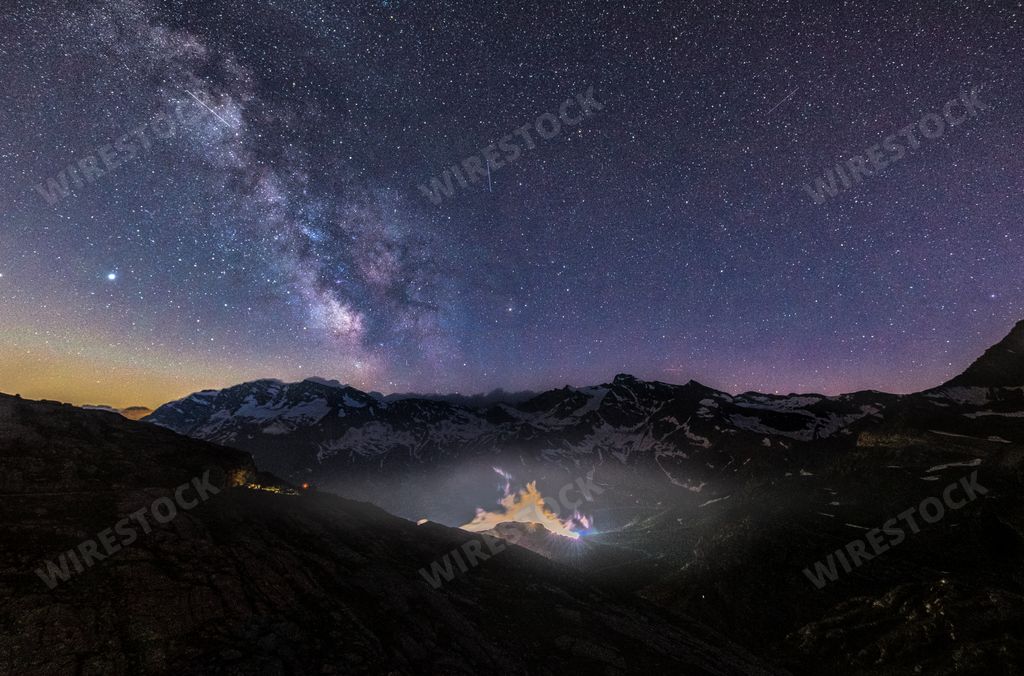 A beautiful shot of Gran Paradiso Park, Alps, Valle d'Aosta, Italy under a starry night sky