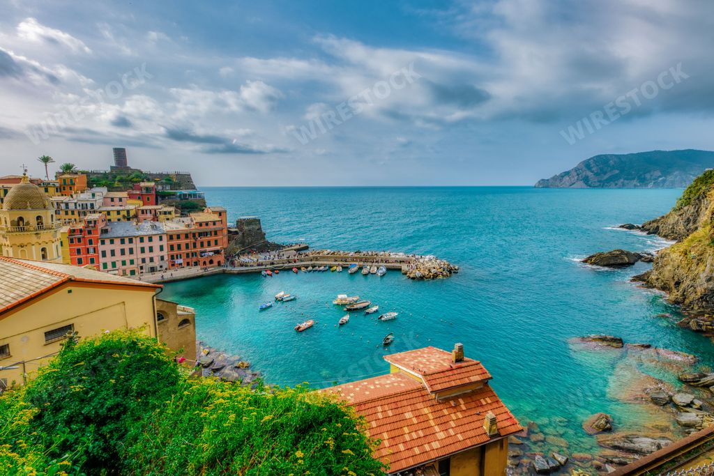 A vibrant view of the Vernazza, Cinque Terre Bay and the picturesque skyline in the background